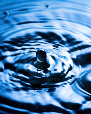 Splashes of water and blurry waves on it.の写真素材