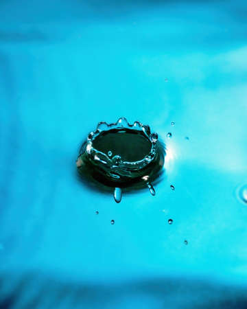 Splashes of water and blurry waves on it.