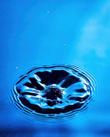 Splashes of water and blurry waves on it.の写真素材