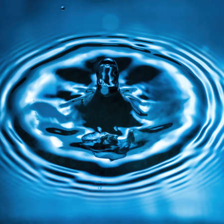 Splashes of water and blurry waves on it.の写真素材