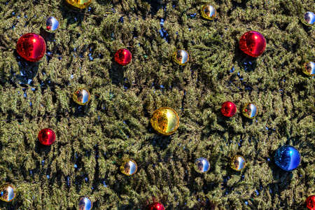 Christmas toys and balls on an artificial spruce. Xmas abstract background.の写真素材