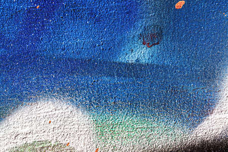A fragment of colorful graffiti painted on a wall. Abstract urban background for design.の写真素材