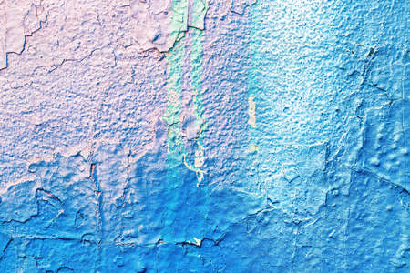 A fragment of colorful graffiti painted on a wall. Abstract urban background for design.