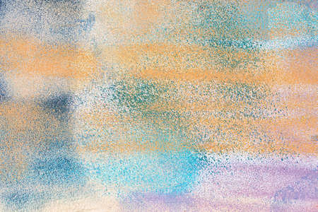 A fragment of colorful graffiti painted on a wall. Abstract urban background for design.