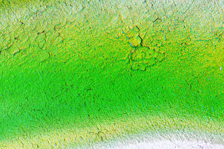 A fragment of colorful graffiti painted on a wall. Abstract urban background for design.の写真素材