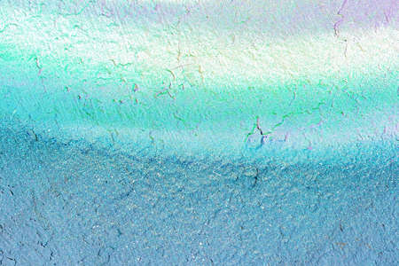 A fragment of colorful graffiti painted on a wall. Abstract urban background for design.