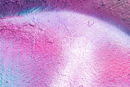 A fragment of colorful graffiti painted on a wall. Abstract urban background for design.の写真素材