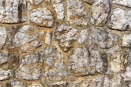 Texture of an old antique stone wall.
