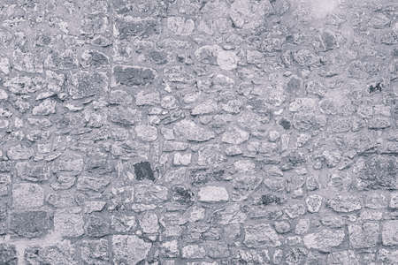 Texture of an old antique stone wall.