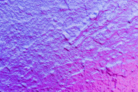 A fragment of colorful graffiti painted on a wall. Abstract urban background for design.