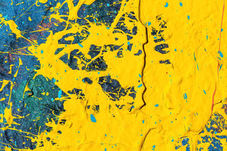 A fragment of colorful graffiti painted on a wall. Abstract urban background for design.の写真素材