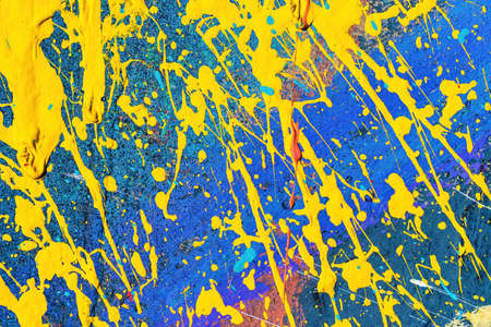 A fragment of colorful graffiti painted on a wall. Abstract urban background for design.