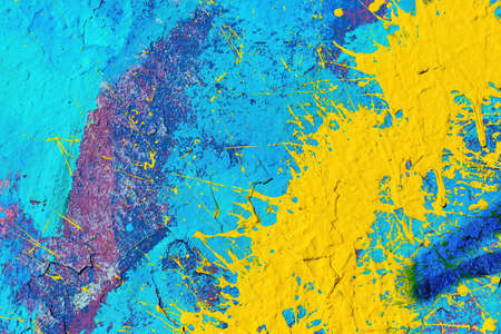 A fragment of colorful graffiti painted on a wall. Abstract urban background for design.の写真素材