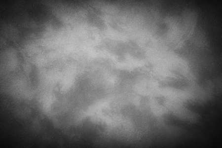 Texture of gray decorative plaster or concrete with vignette. Abstract grunge wallpaper background for design.の写真素材