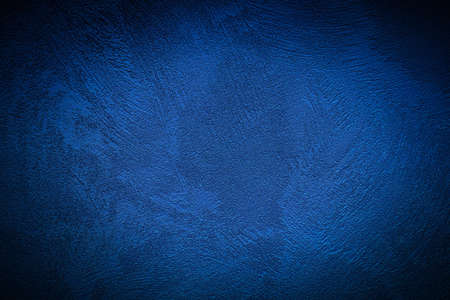 Texture of blue decorative plaster or concrete with vignette. Abstract grunge background for design.