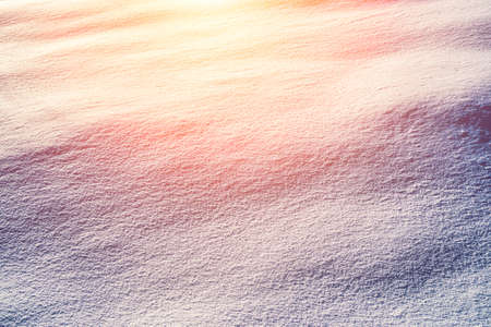 Texture of snow illuminated by sunlight. winter background.の写真素材