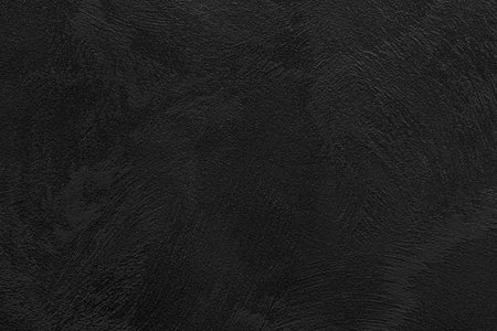 Texture of black decorative plaster or concrete. Abstract grunge background for design.の写真素材