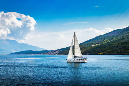 Sailing ship in the bay of the Adriatic Sea. Vacation on a sailboat near the coast.の写真素材