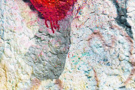 A fragment of colorful graffiti painted on a wall. Abstract urban background for design.の写真素材