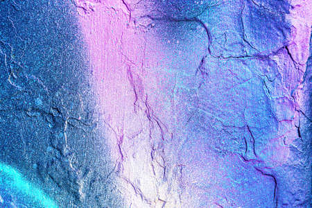 A fragment of colorful graffiti painted on a wall. Abstract urban background for design.の写真素材