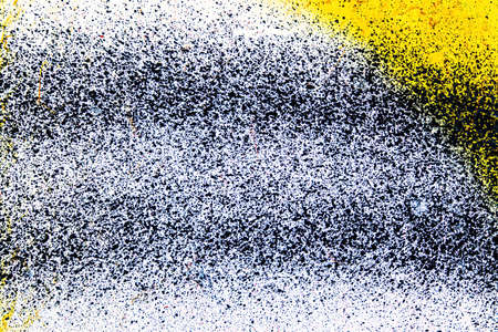 A fragment of colorful graffiti painted on a wall. Abstract urban background for design.の写真素材