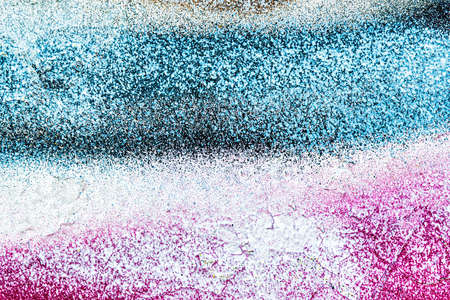 A fragment of colorful graffiti painted on a wall. Abstract urban background for design.の写真素材