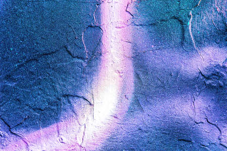 A fragment of colorful graffiti painted on a wall. Abstract urban background for design.の写真素材