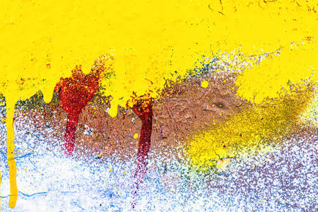 A fragment of colorful graffiti painted on a wall. Abstract urban background for design.