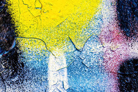 A fragment of colorful graffiti painted on a wall. Abstract urban background for design.の写真素材