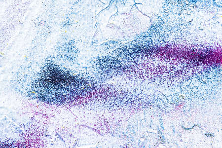 A fragment of colorful graffiti painted on a wall. Abstract urban background for design.の写真素材