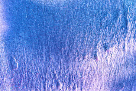 A fragment of colorful graffiti painted on a wall. Abstract urban background for design.