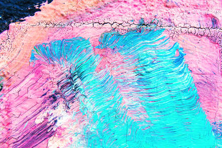 A fragment of colorful graffiti painted on a wall. Abstract urban background for design.の写真素材