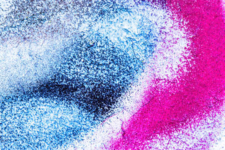 A fragment of colorful graffiti painted on a wall. Abstract urban background for design.