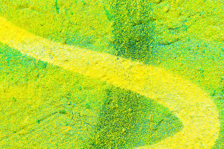 A fragment of colorful graffiti painted on a wall. Abstract urban background for design.の写真素材