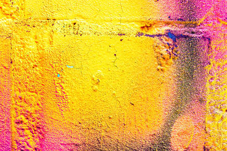 A fragment of colorful graffiti painted on a wall. Abstract urban background for design.の写真素材