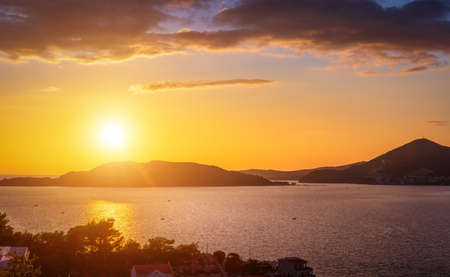 Sunset on the Adriatic coast near the city of Budva, Montenegro. View of the sea and rocks.の写真素材