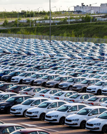 Volkswagen Group Rus, Russia, Kaluga - MAY 25, 2020: Rows of a new cars parked in a distribution center on a car factory parking.のeditorial素材