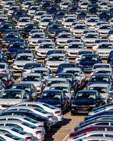 Volkswagen Group Rus, Russia, Kaluga - MAY 25, 2020: Rows of a new cars parked in a distribution center on a car factory parking.のeditorial素材
