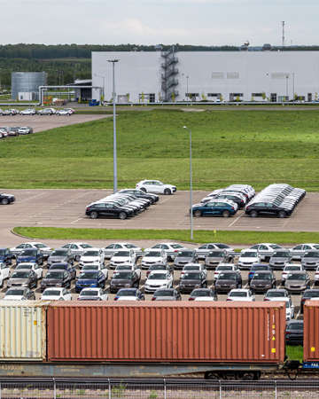Volkswagen Group Rus, Russia, Kaluga - MAY 25, 2020: Rows of a new cars parked in a distribution center on a car factory parking.のeditorial素材