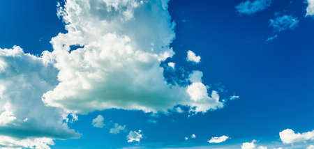 White cumulus clouds in the blue sky. cloudy sky background.