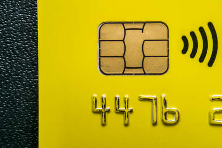 Close-up shot of a debit or credit plastic card with a chip.の写真素材