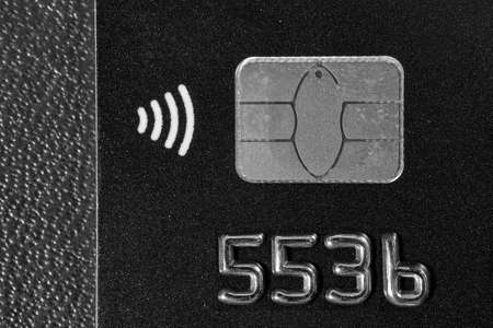 Close-up shot of a debit or credit plastic card with a chip.の写真素材