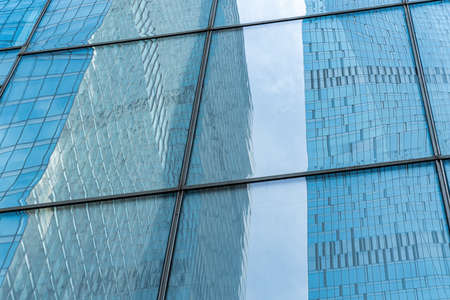 Fragment of a modern office building. Abstract geometric background. Part of the facade of a...
