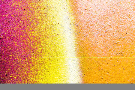A fragment of colorful graffiti painted on a wall. Abstract urban background for design. spray painting art.の写真素材