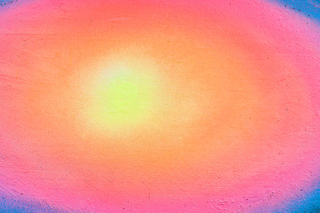 A fragment of colorful graffiti painted on a wall. Abstract urban background for design. spray painting art.の写真素材