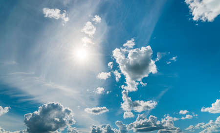 White cumulus clouds in the blue sky. cloudy sky background.の写真素材