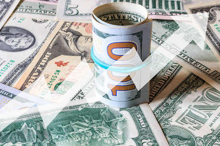 Arrow up on the background of dollar bills. The concept of the growth of the dollar, success,...