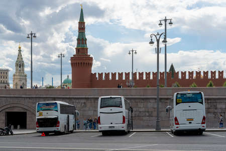 MOSCOW, RUSSIA - JULY 16, 2022: Parking lot of sightseeing buses near Red Square and the Kremlin walls.の写真素材