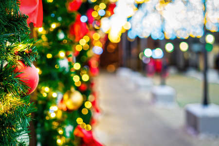 Christmas balls, toys and glowing garlands on an artificial spruce. Xmas abstract background.の写真素材