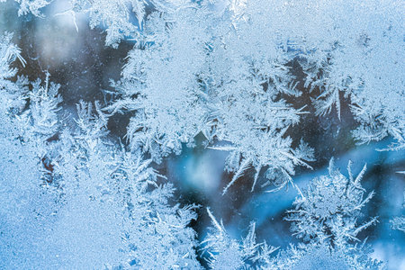 Frost texture on frozen glass in winter. Winter background.